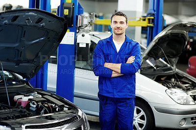 Buy stock photo Mechanic, engine and portrait with man in workshop for motor oil change, car inspection and auto repair. Arms crossed, transmission maintenance and transport diagnostics with person in garage