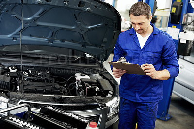 Buy stock photo Man, engineer and inspection on clipboard for car at workshop  for notes, report or repair services. Person, technician or mechanic with vehicle, checklist and maintenance with career at auto garage