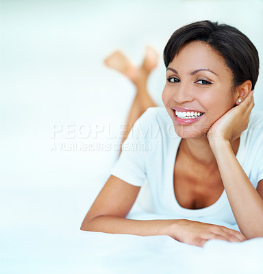 Buy stock photo Portrait, woman and relax in hotel room with bed, positive attitude and good mood for weekend getaway. Space, female person and unwind in accommodation with smile, wellness and peaceful vacation.