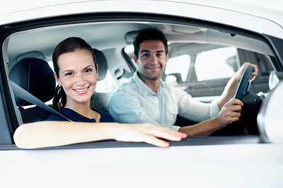 Buy stock photo Dealership, portrait and smile of couple in car together for choice, purchase or test drive. Retail, sale and window with happy customer people in showroom for decision, shopping or vehicle finance