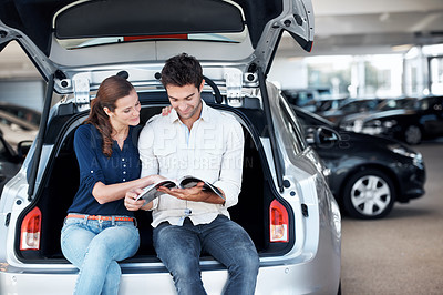 Buy stock photo Selection, car or couple at dealership with brochure, option guide or automobile choice in showroom. Smile, relationship or people with leaflet, decision together or purchase info with vehicle review