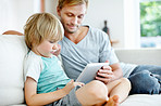 The boys at home with their tech toy