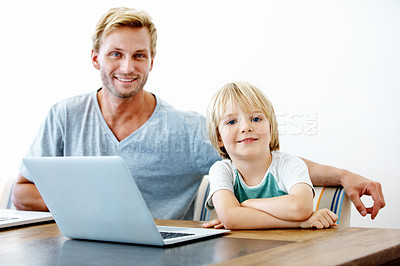 Buy stock photo Portrait of a young father and his son with their laptops