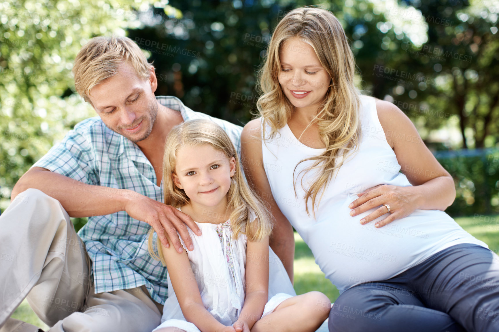 Buy stock photo Smile, parents and relax in nature with child, love and summer holiday for bonding together. Portrait, father or pregnant woman at park with daughter, connection and weekend break for family vacation