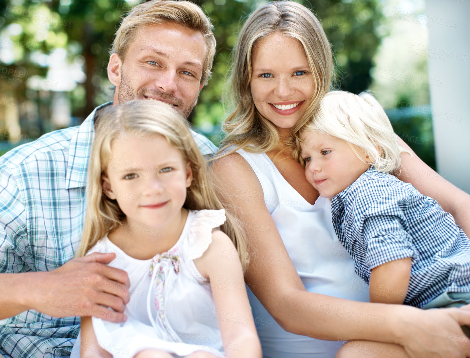 Buy stock photo Happy, parents and kids with love in backyard for weekend break, bonding together and support. Care, people and children portrait in home garden for family connection, healthy relationship and trust
