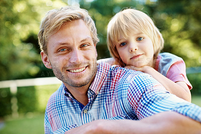 Buy stock photo Cute little boy playing in a garden with his dad during the summertime