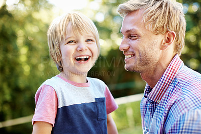 Buy stock photo Cute little boy playing in a garden with his dad during the summertime