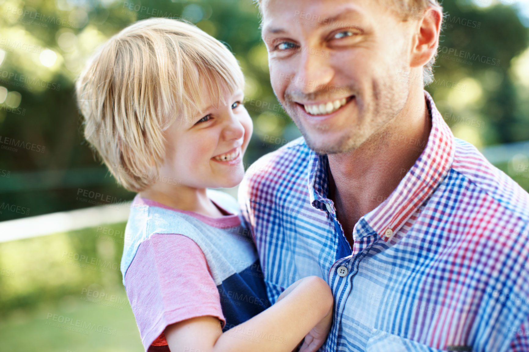 Buy stock photo Cute little boy playing in a garden with his dad during the summertime