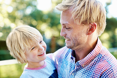 Buy stock photo Cute little boy playing in a garden with his dad during the summertime