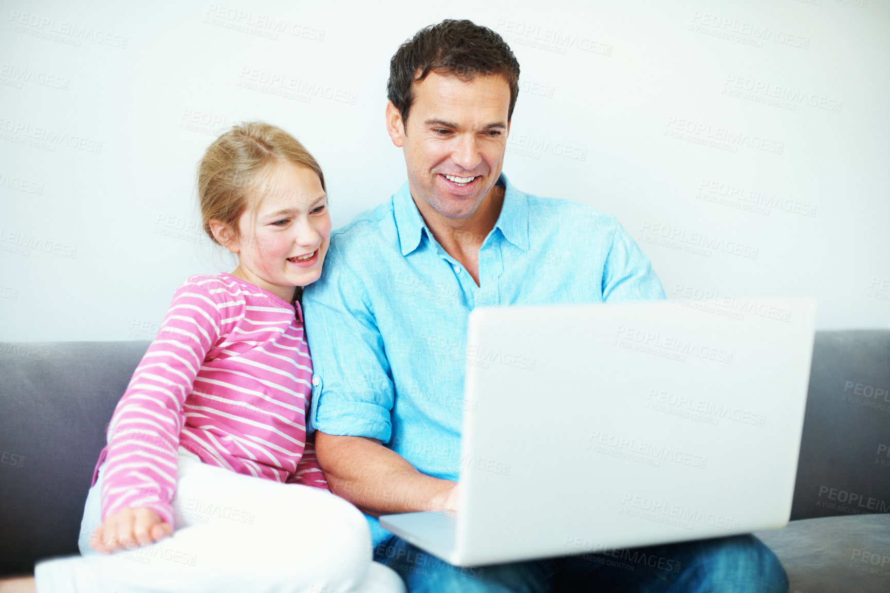 Buy stock photo Father, child and watching movie in home with laptop, streaming cartoon or bonding together on weekend. Happy, man and daughter relax in living room with computer, kids show and online entertainment.