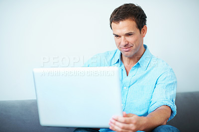 Buy stock photo Remote work, review or man on sofa with laptop, proofreading or novel editing in living room. WFH, space or author in house with tech, typing manuscript or chapter planning in story development.