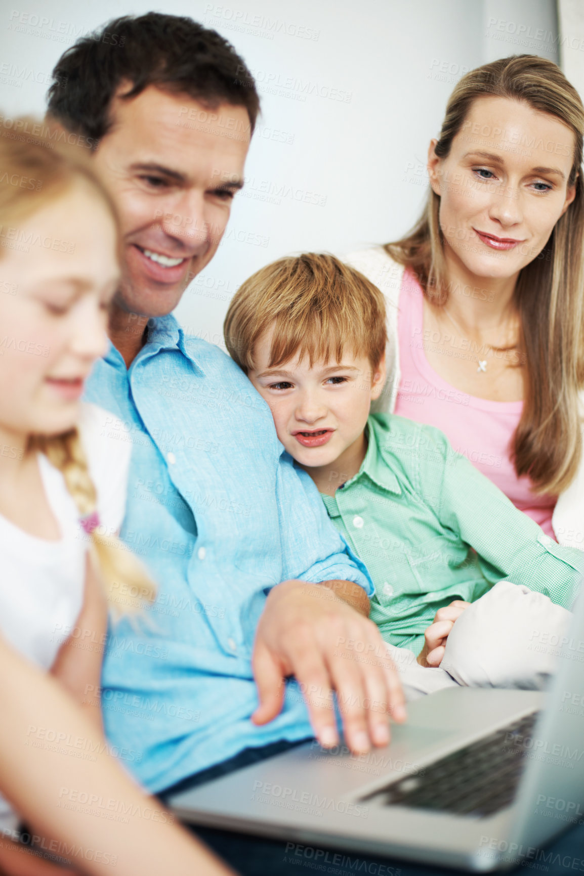 Buy stock photo Laptop, happy family and parents with kids for educational game, bonding and development in home. Sibling, mother and father with computer for learning with children, relax or reading story at house