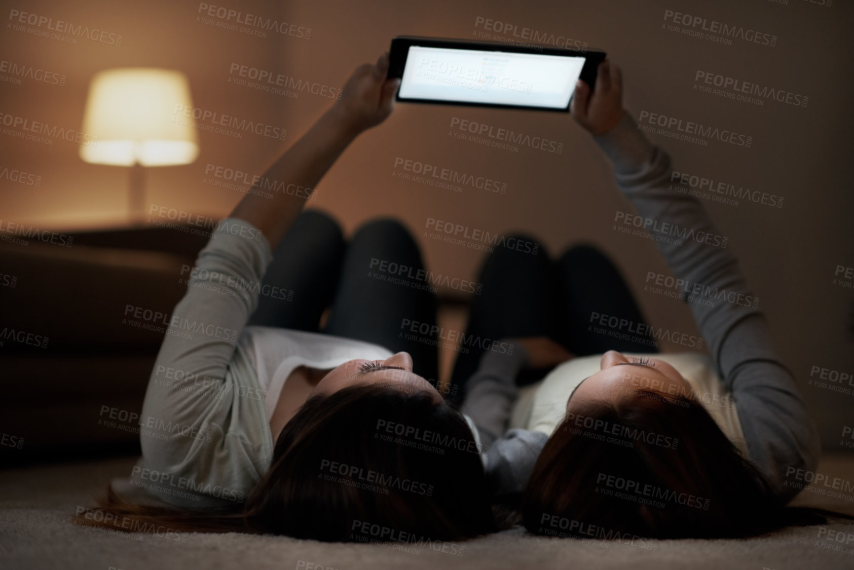 Buy stock photo Tablet, night and screen with sisters in home for social media post, teenagers and bonding. Late streaming, entertainment and online subscription with girl in house for connection and weekend break