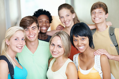 Buy stock photo Teen, group and smile in portrait at high school for scholarship, study support and break. Happy students, girls and boys with backpack at learning academy for development, education and class recess