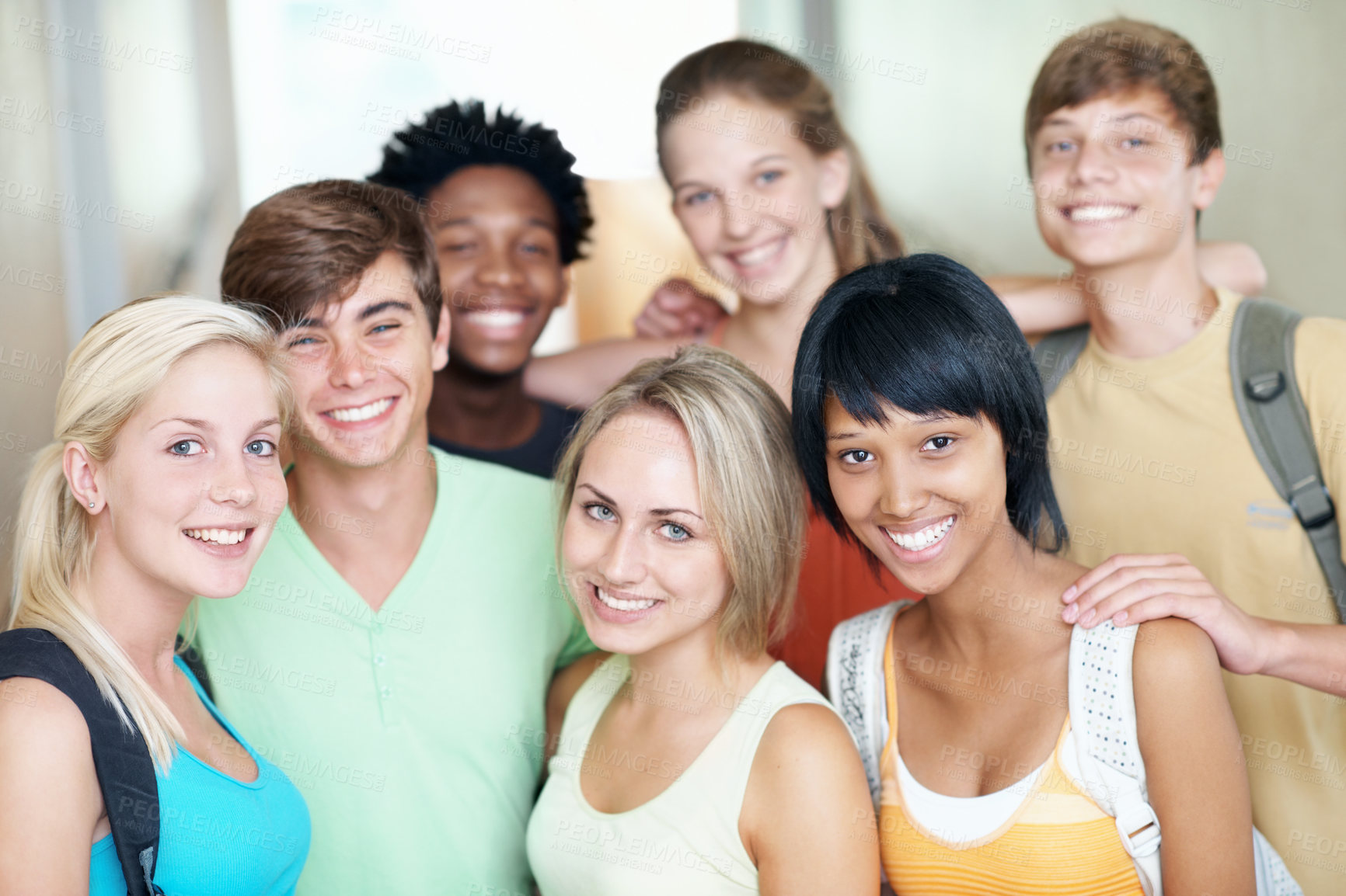 Buy stock photo Teen, group and smile in portrait at high school for scholarship, study support and break. Happy students, girls and boys with backpack at learning academy for development, education and class recess