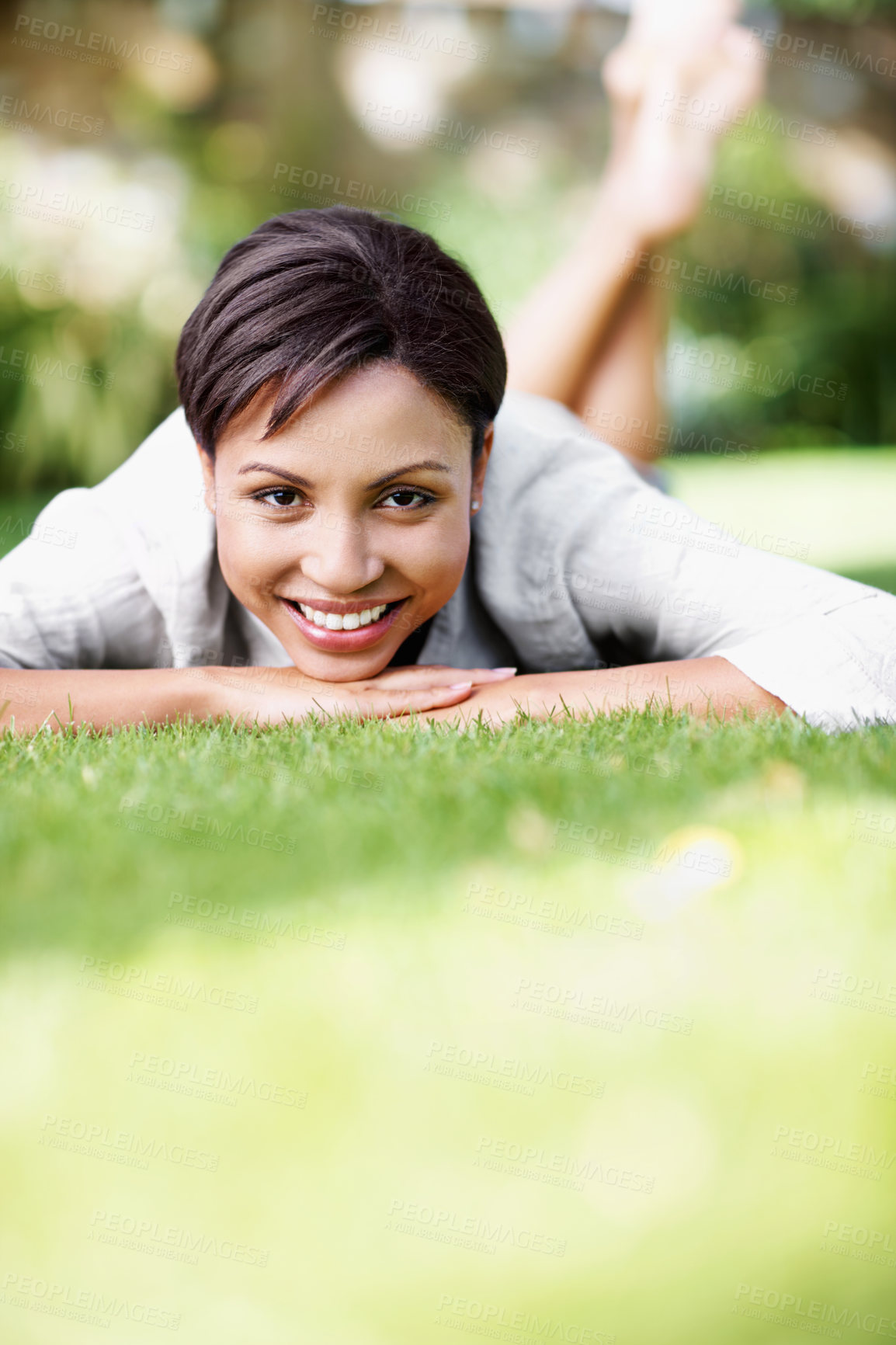 Buy stock photo Portrait, rest and woman on grass with smile, peace and comfortable for summer holiday. Bokeh, female person and lawn in nature with positive attitude, calm morning and unwind at vacation destination