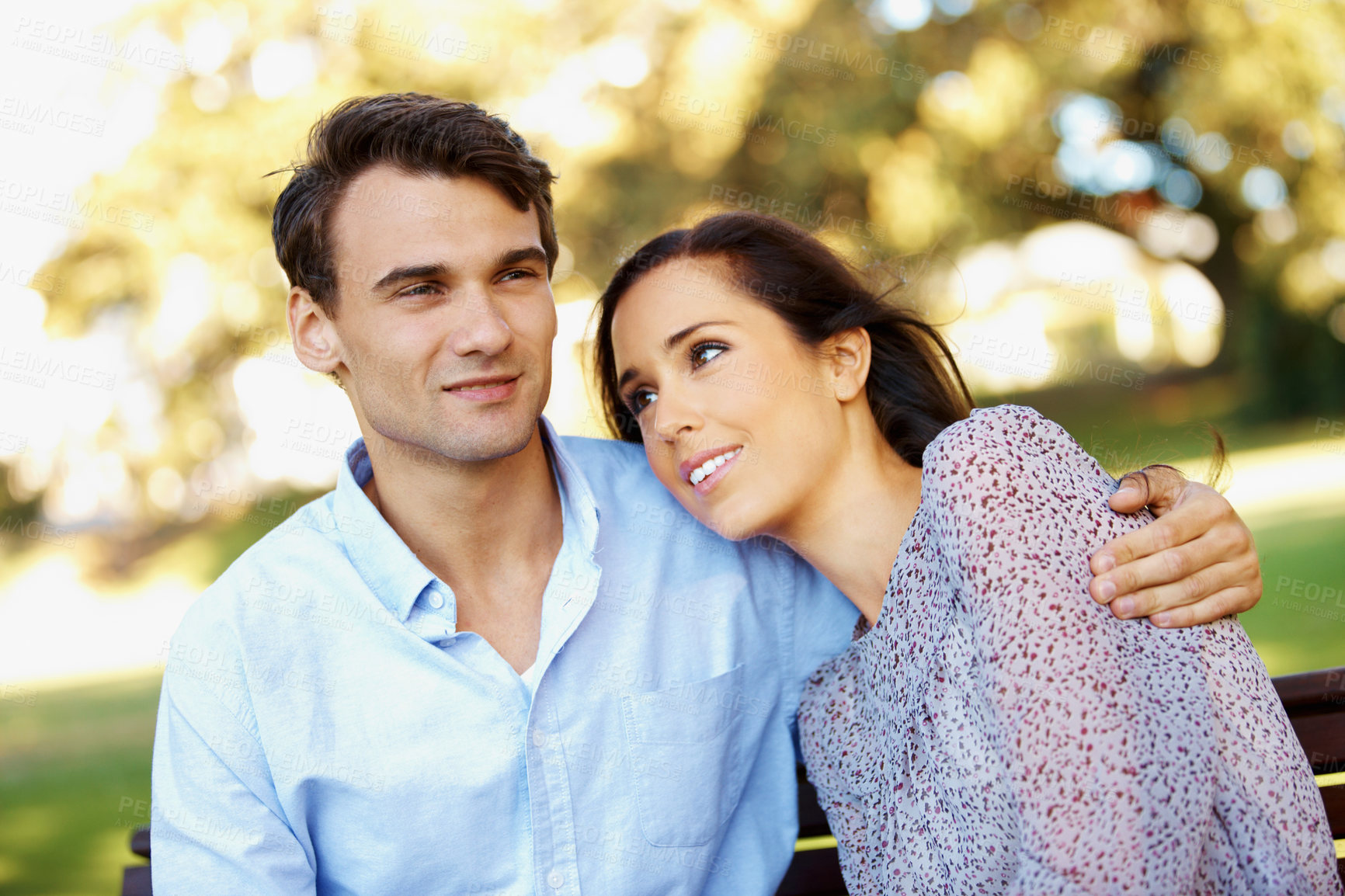 Buy stock photo Date, happy and support with couple on park bench for connection, honeymoon vacation and bonding. Smile, spring and care with man and woman outdoor for commitment, romance and relationship together