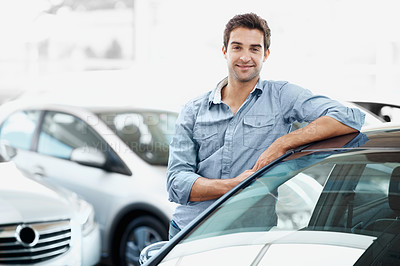 Buy stock photo Man, portrait and smile in car dealership for vehicle purchase, appointment and confidence. Loan approval, showroom and person shopping for motor rental, retail and service for transport buyer