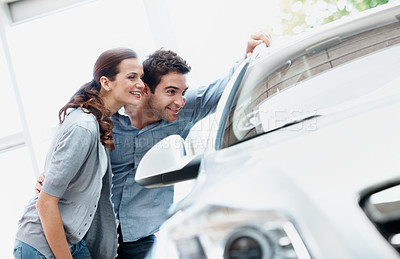 Buy stock photo Dealership, shopping and couple check car, evaluation and decision for automobile with partner. Showroom, man and woman with dream vehicle for purchase, buyer or customers with transport choice