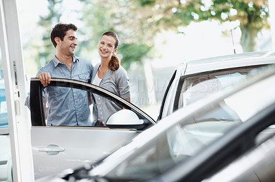 Buy stock photo Happy, couple and customer shopping in car dealership with support, inspection and motor insurance. Portrait, married people and browsing in store for new vehicle, investment decision and evaluation.