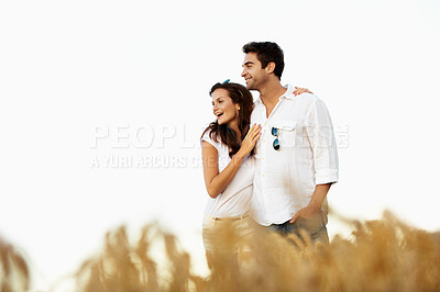 Buy stock photo Love, happy couple and hug at field on holiday for connection, sightseeing and laughing. Funny, woman and man embrace in countryside with partner for view, support and bonding with mockup space