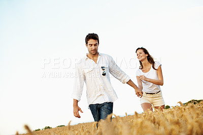 Buy stock photo Excited, couple and holding hands in wheat field for holiday, bonding or romance in countryside. Space, man and woman in nature for weekend trip together with vacation, anniversary and playful travel