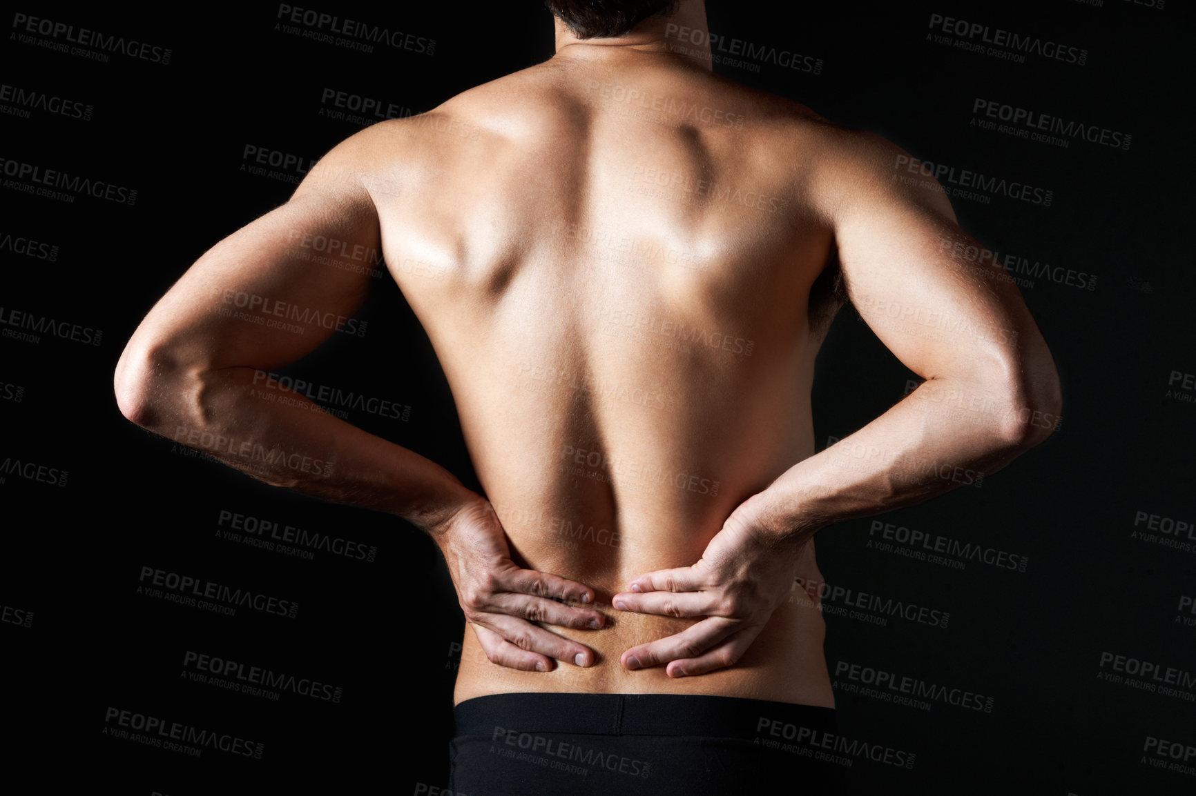 Buy stock photo Shirtless, massage and man in studio for back pain, inflammation or injury with arthritis. Fibromyalgia, sprain and male person by black background with muscle tension, accident or joint ache.