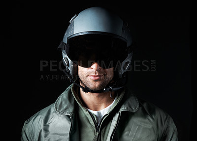 Buy stock photo Hero, military and pilot with helmet on man in studio for army militant, war and aerial combat expert. Airspace mission, aviator and soldier with person on black background for security and gear