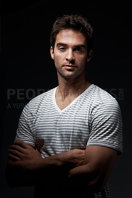 Buy stock photo Man, portrait or studio with confidence for fashion, style or mysterious behaviour on a dark background. Serious, male person or clothing with arms crossed or shadow for hidden or secret identity
