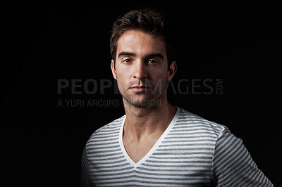 Buy stock photo Creative, man and designer in studio with portrait, career pride and about us for clothing launch. Serious, male person and entrepreneur with ambition, attitude and apparel tailor on dark background