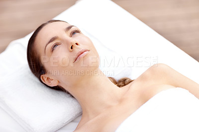 Buy stock photo Pretty young woman lying serenely while waiting for a spa treatment to begin