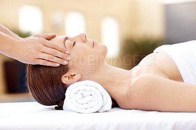 Buy stock photo Profile shot of a beautiful woman receiving a massaging spa treatment from a therapist 