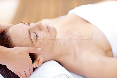 Buy stock photo Profile shot of a beautiful woman receiving a massaging spa treatment from a therapist 