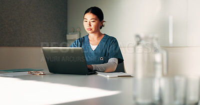 Buy stock photo Healthcare, nurse and woman with laptop in clinic, administration or reading medical records on web. Health professional, online and asian person with tech for test results, info or hospital research