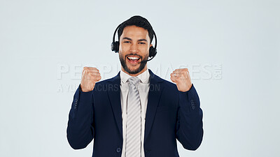 Buy stock photo Business, man and fist pump in studio with headset, customer praise or success of sales kpi. Portrait, mockup space or agent cheering for good news, technical support and helpdesk on white background