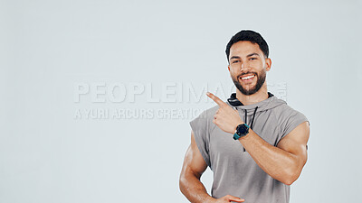 Buy stock photo Man, pointing and marketing for fitness, gym membership sign up or info mockup space. Personal trainer, guide or steps to join exercise club with advertising, portrait and ads on studio background