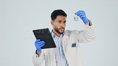 Buy stock photo Scientist, tablet and man with chemical beaker in studio for inspection, pharma development and space. Science, chemistry or person with tech for drug experiment, medical research or white background