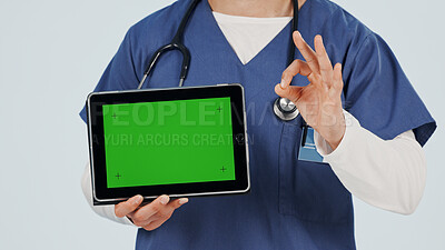 Buy stock photo Nurse, tablet and hands with green screen for marketing app on a white studio background. Person, healthcare worker or showing mockup space with technology or OK sign for advertising or good review