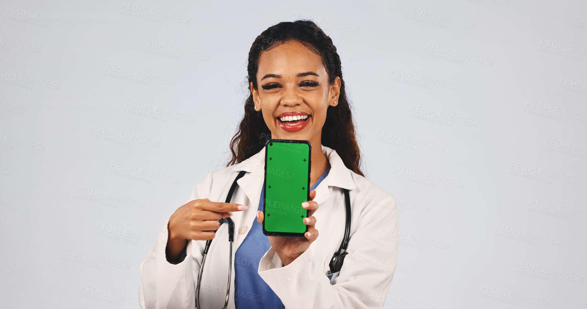 Buy stock photo Doctor, phone and green screen with pointing for mockup space, online results or telehealth ux. Woman, studio portrait and smile by tech for motivation, ui or advertising app on white background 