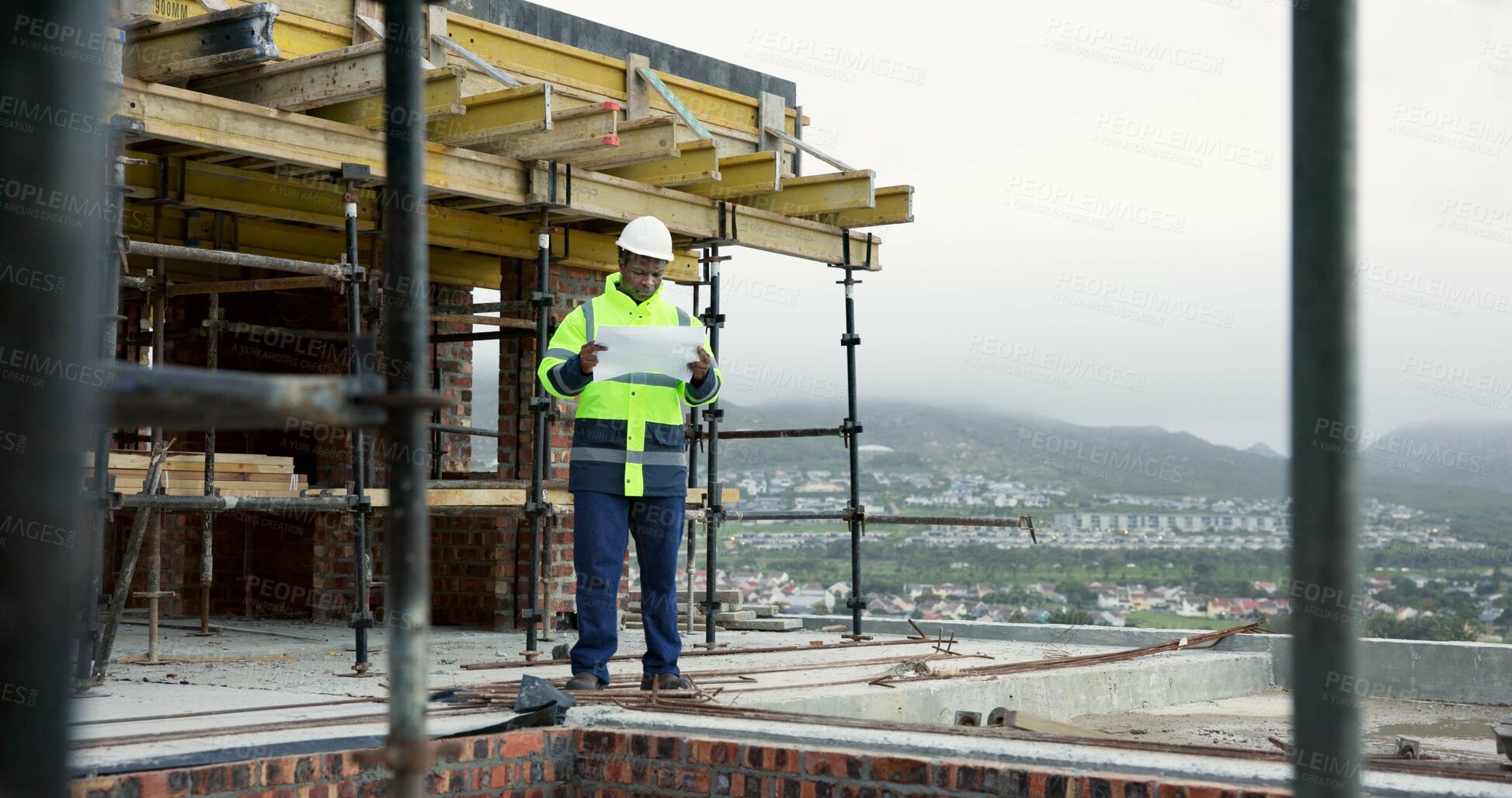 Buy stock photo Architect, construction and man with blueprint on roof, building inspection and plan for renovation. City, civil engineering and black person with document, architecture and property development