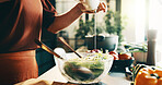 Salad, olive oil and hands of woman in kitchen at house for nutrition, health or diet meal. Vegetables, dressing and female person with fresh ingredients for wellness, dinner or dish in apartment.