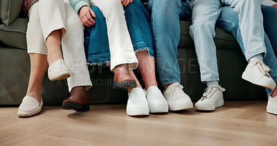 Buy stock photo Legs, family and relax on sofa for bonding together, kids and parents on break with connection in house. Shoes, children and people on couch in living room, chill or love with comfort at home