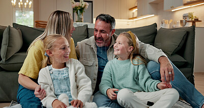 Buy stock photo Relax, children and parents with talk in house for bonding together, happy home and security. Love, family and girls with conversation on floor for relationship development, support and weekend break