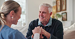 Happy, caregiver and comfort old man with walking stick, support and compassion for recovery. Nurse, consoling and  senior person with disability, assisted living and rehabilitation progress at house