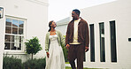Couple, walk and holding hands in garden with new home, property investment and real estate goals. Happy, black people and moving in house with relocation, mortgage loan and trust for relationship.