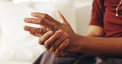Buy stock photo Arthritis, hand and massage with person in home living room for joint pain, stiffness or swelling. Disease, fibromyalgia or osteoporosis with elderly woman on sofa in apartment for health condition