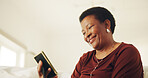 Mature, woman and smile in house with photo frame, good memories and reflection for past history. Happy, black person thinking and relax in living room with picture, nostalgia and remember souvenir.