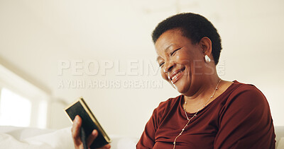 Buy stock photo Mature, woman and smile in house with photo frame, good memories and reflection for past history. Happy, black person thinking and relax in living room with picture, nostalgia and remember souvenir.