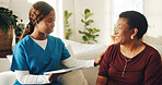 Patient, smile and nurse in home with tablet, medical test results and conversation for diagnosis. Mature woman, black people and discussion on sofa with tech, healthcare support and wellness update.