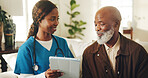 Nurse, tablet and senior man in home with smile, medical test results and feedback for diagnosis. Black people, pensioner and healthcare worker on couch with tech, advice and checkup for wellness.